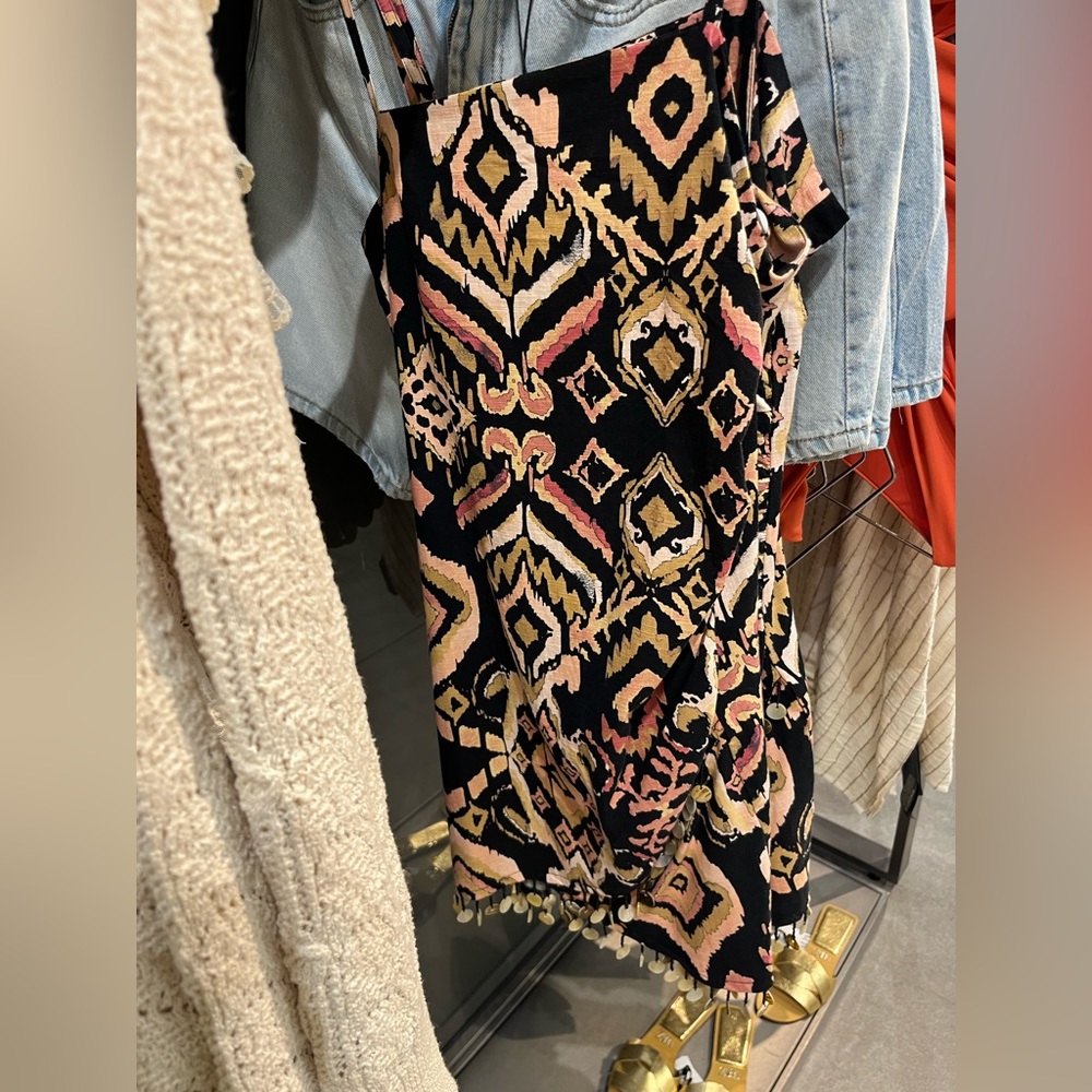 ISO Zara linen dress with shells on the bottom in size med or large.